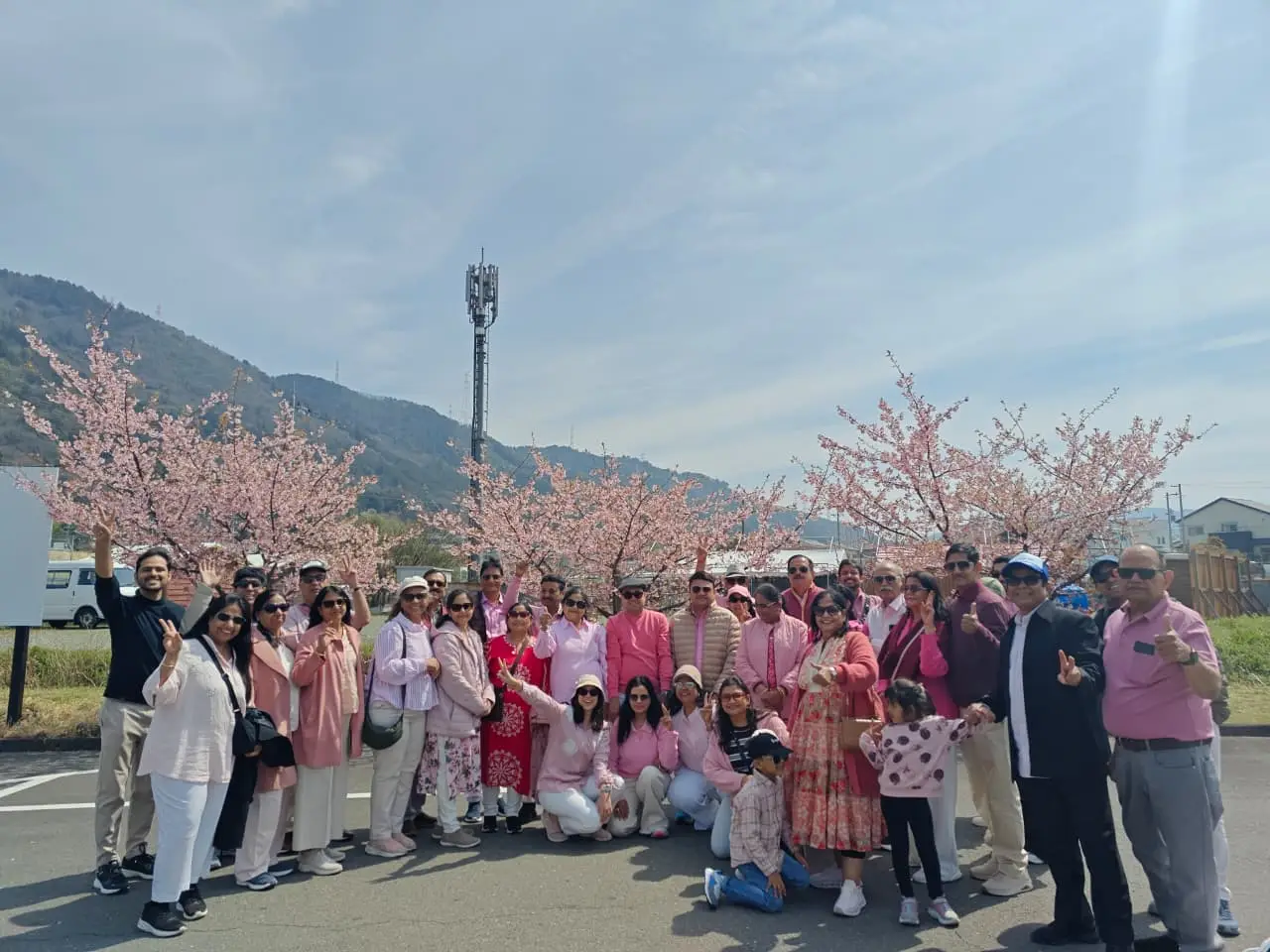 A 40-plus pax Odaduu group under cherry blossoms in Japan